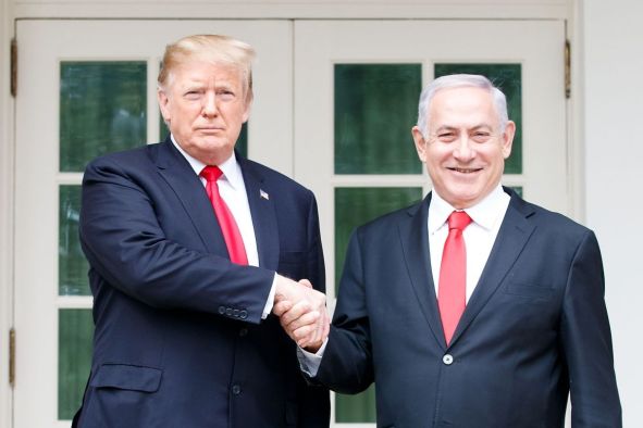WASHINGTON, March 25, 2019 (Xinhua) -- U.S. President Donald Trump (L) shakes hands with Israeli Prime Minister Benjamin Netanyahu during their meeting at the White House in Washington D.C., the United States, on March 25, 2019. U.S. President Donald Trump on Monday signed a proclamation recognizing Israel's sovereignty over the disputed Golan Heights, territory that Israel seized from Syria in 1967. (Xinhua/Ting Shen/IANS)